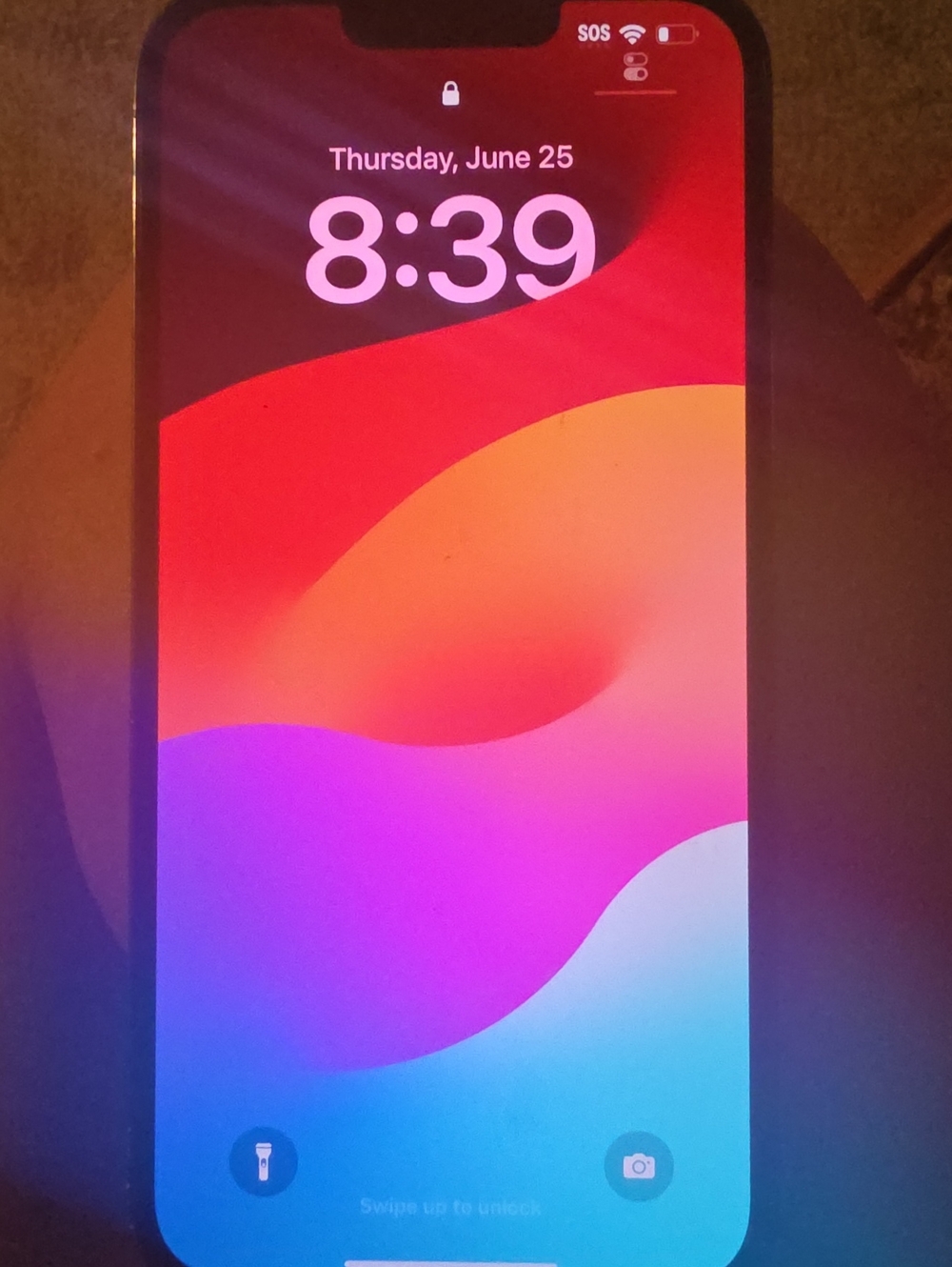 Apple iPhone Lock Screen with Red, Pink, Purple, Blue Gradient